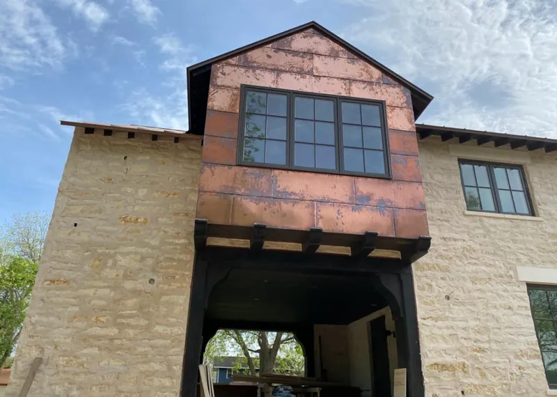 Copper metal panel facade on a stone building for Metal Roof Coating in Sewickley