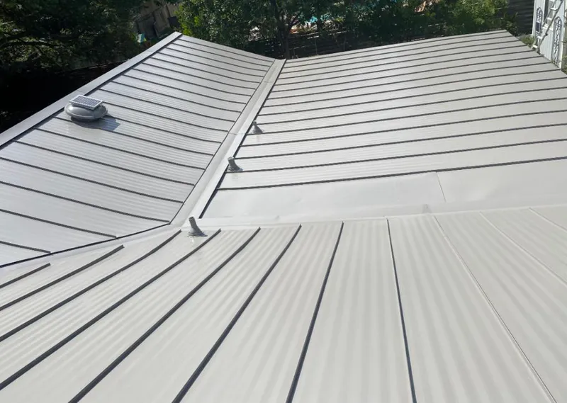 Solar attic fan installed on a metal roof for Roof Ventilation in Sewickley